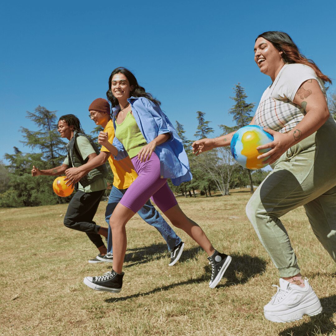 group of mentees playing outside in a park